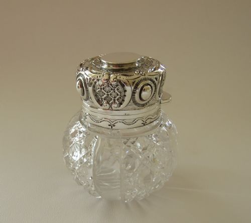 A Spectacular Silver Mounted Victorian Cologne Bottle.