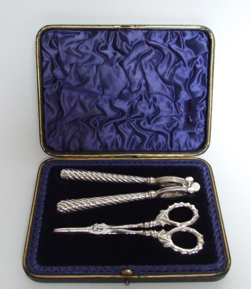 A Wonderful Boxed Set of Silver Handled Nut Crackers and Grape Shears.