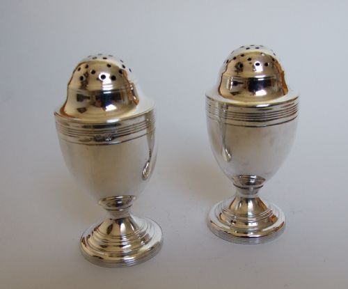 A Rare Pair of Georgian Silver Pepper Pots, by a Female Silversmith.