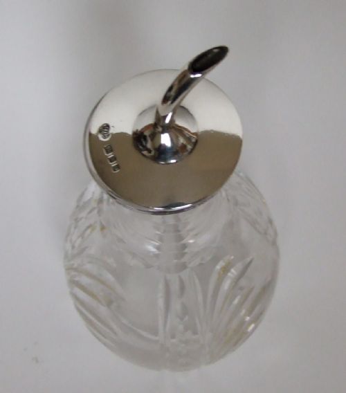 fig 1. An attractive silver mounted bitters jigger.