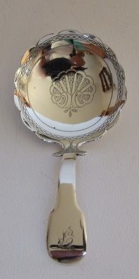 An Unusual George III Silver Caddy Spoon.