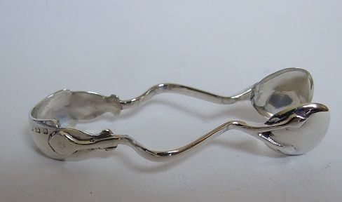 A Rare Pair of Silver Arts & Crafts Shaped Tongs.