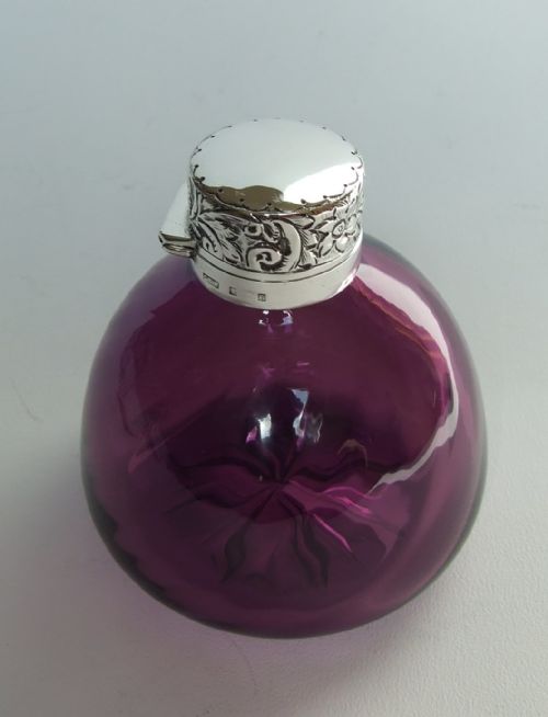 fig 1. A gorgeous silver mounted amethyst glass cologne bottle.
