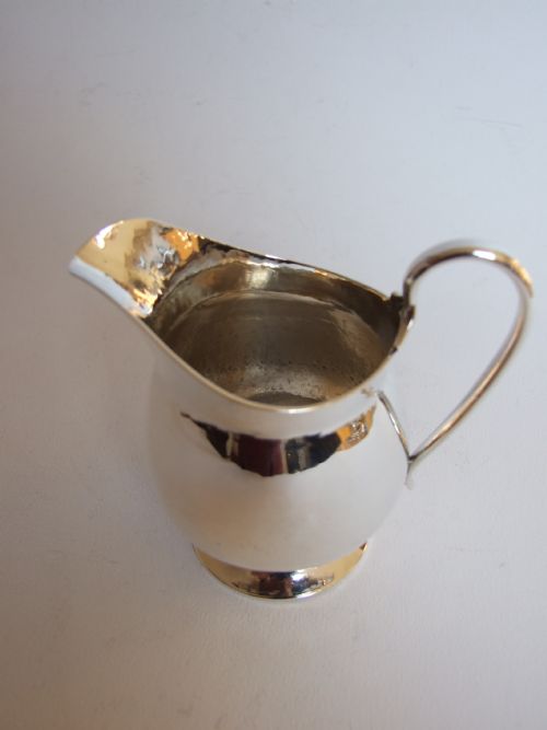 fig 1. A superb quality Arts & Crafts silver cream jug.