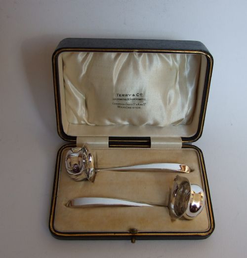A Charming Boxed Silver Cream Ladle & Sugar Sifter Ladle.