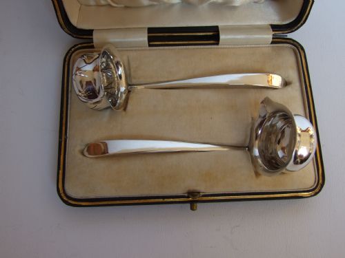fig 1. A charming boxed silver cream ladle & sugar sifter ladle.