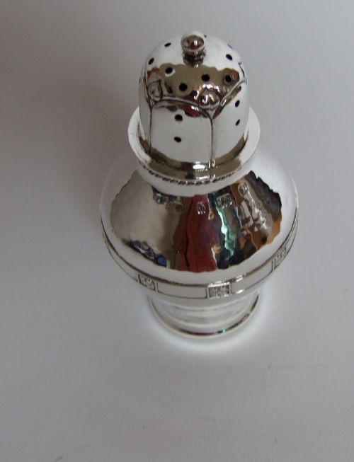 fig 1. A superb A E Jones Arts & Crafts silver caster.