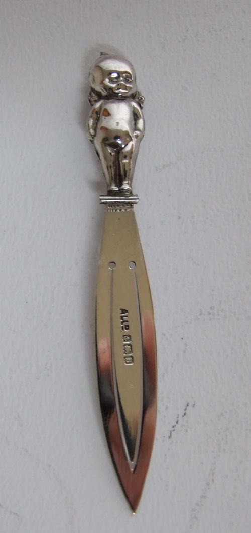 An Extremely Rare Silver Cherub Bookmark.