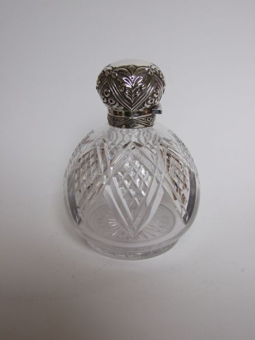 A Superb Edwardian Silver Mounted Cologne Bottle.