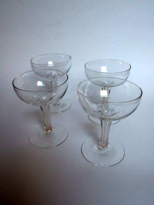 A Good Set of Four Late Victorian Hollow Stem Champagne Glasses.