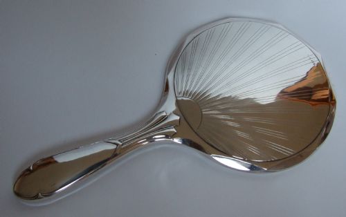 A Stylish Art Deco Silver Hand Mirror.