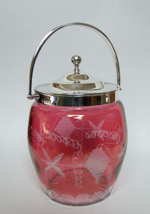 A Stunning Silver Mounted Cranberry Biscuit Barrel.