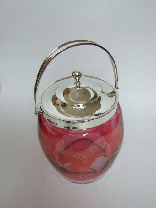 fig 1. A stunning silver mounted cranberry biscuit barrel.