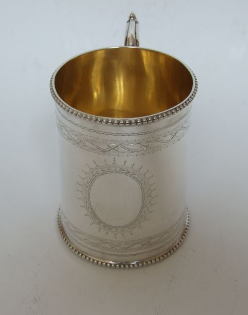 A Superb Mid Victorian Silver Gilt Christening Mug.