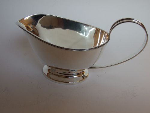 A Handsome Art Deco Period Silver Gravy Boat.