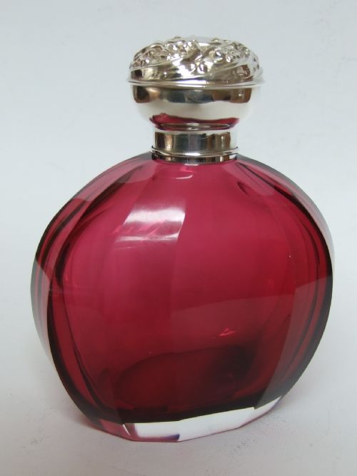 A Fabulous Silver & Cranberry Cologne Bottle.
