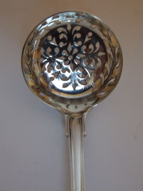 fig 1. A superb George IV silver fiddle, thread & shell sifter spoon.