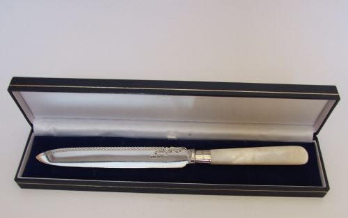 Exactly 100 Years Old. A Silver Bladed Cake Knife in a Presentation Box.