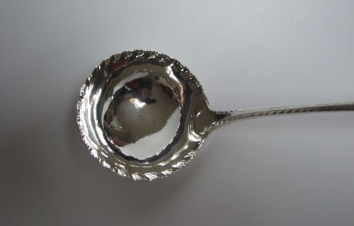 fig 1. A magnificent George II silver soup ladle.