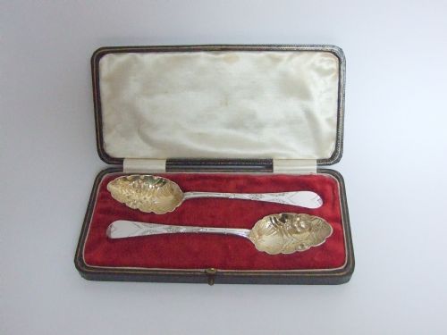 fig 1. A wonderful pair of boxed Newcastle silver gilt fruit spoons.