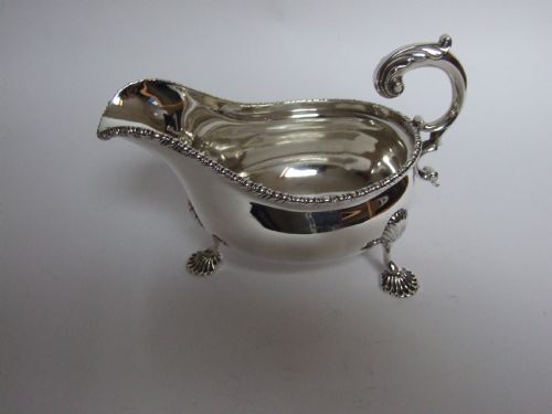 fig 1. A handsome Edwardian silver gravy boat.