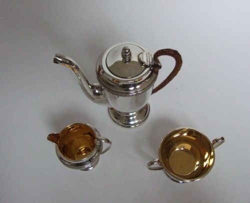 fig 2. An outstanding boxed silver cafe a deux with Royal Doulton coffee cans and silver spoons.