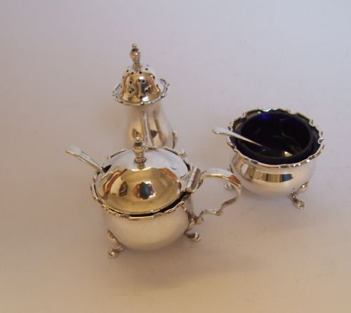 A Delightful Three Piece Silver Cruet with Original Spoons.