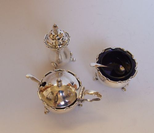 fig 1. A delightful three piece silver cruet with original spoons.
