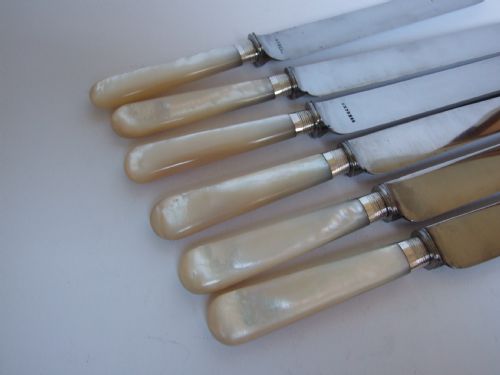 fig 1. Six gorgeous silver & mother of pearl dinner knives.