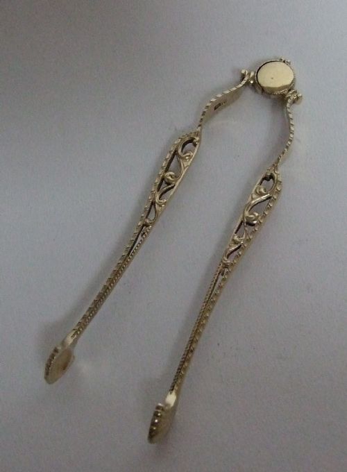 A Gorgeous Pair of Silver Gilt Tongs.
