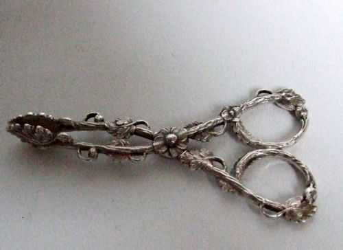 fig 1. A stunning pair of silver naturalistic tea tongs.