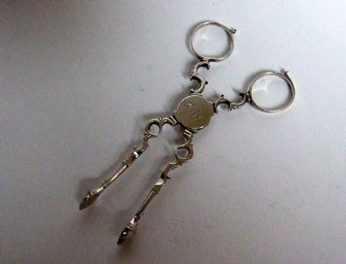 A Pair of 18th Century Quatrefoil Silver Tea Tongs.