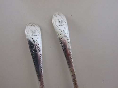 fig 1. An unusual pair of silver fancy back teaspoons.
