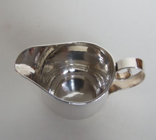 fig 1. A fabulous Britannia standard silver cream jug in the Arts & Crafts style.