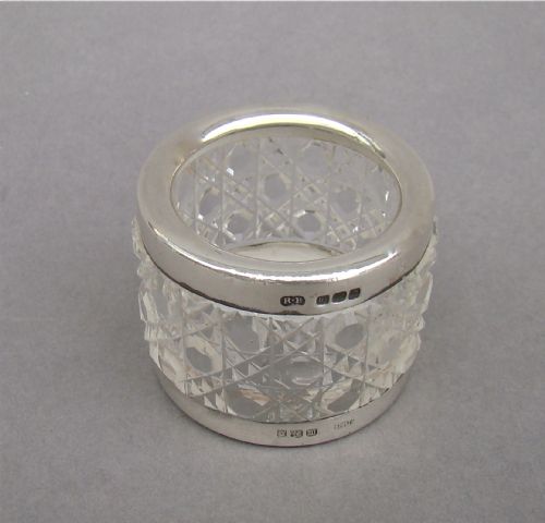 An Unusual Silver Mounted Cut Glass Napkin Ring.