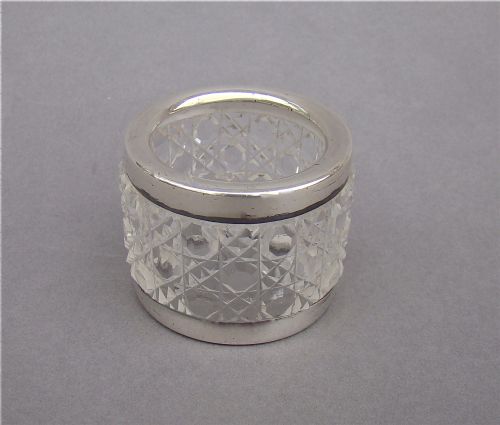 fig 1. An unusual silver mounted cut glass napkin ring.