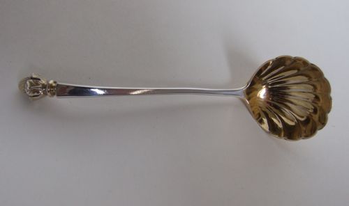 A Fabulous Victorian Cast Silver Gilt Cream Ladle