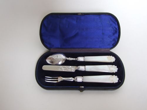 A Mid Victorian Silver & Mother-of-pearl Christening Set.
