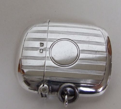 fig 1. A fine engine turned and shaped silver vesta.