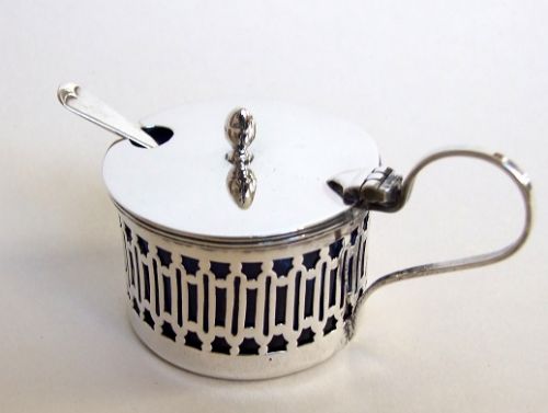 A Charming George V Pierced Silver Mustard Pot and Spoon.