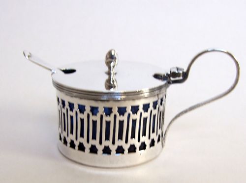 fig 1. A charming George V pierced silver mustard pot and spoon.