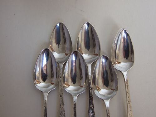 fig 1. Six eighteenth Century Bright Cut silver teaspoons.