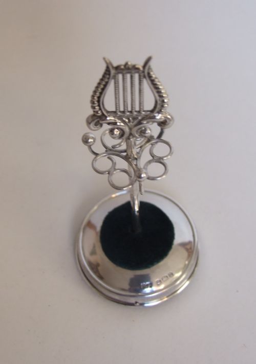 fig 1. A rare Edwardian silver hatpin/ring stand with lyre finial.