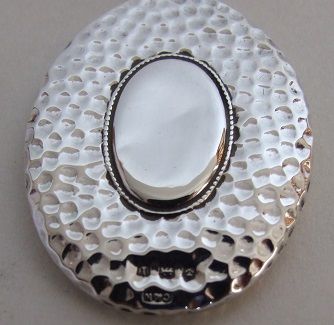 fig 1. An Arts & Crafts hammered silver chatelaine mirror.