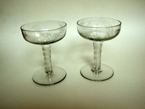 A Rare Pair of Fern Etched Hollow Stem Champagne Glasses.