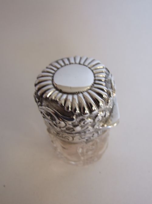 fig 1. A splendid Victorian silver mounted salts/cologne bottle.