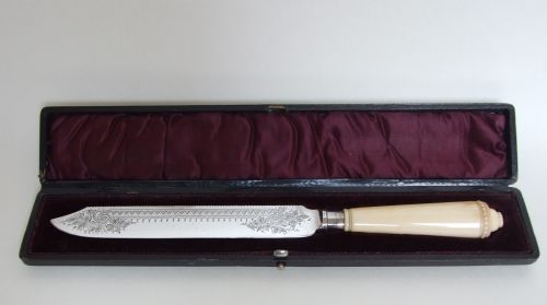A Fabulous Silver Mounted and Boxed Victorian Wedding Cake Knife.