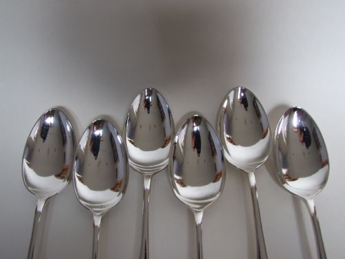 fig 1. Six George V silver dessert spoons in Old English pattern.