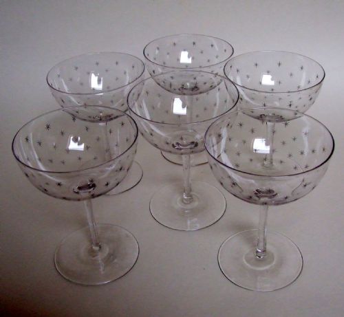 A Fabulous Set of Six Victorian Star Etched Champagne Glasses.
