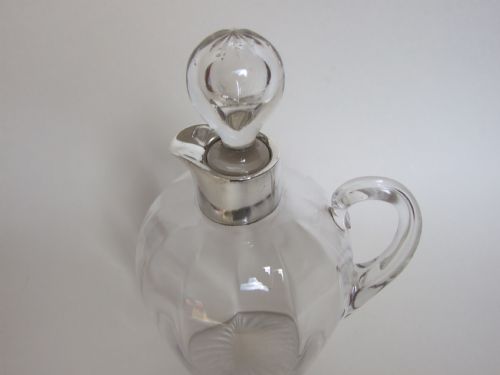 fig 1.  A superb silver mounted Whisky flask and stopper.